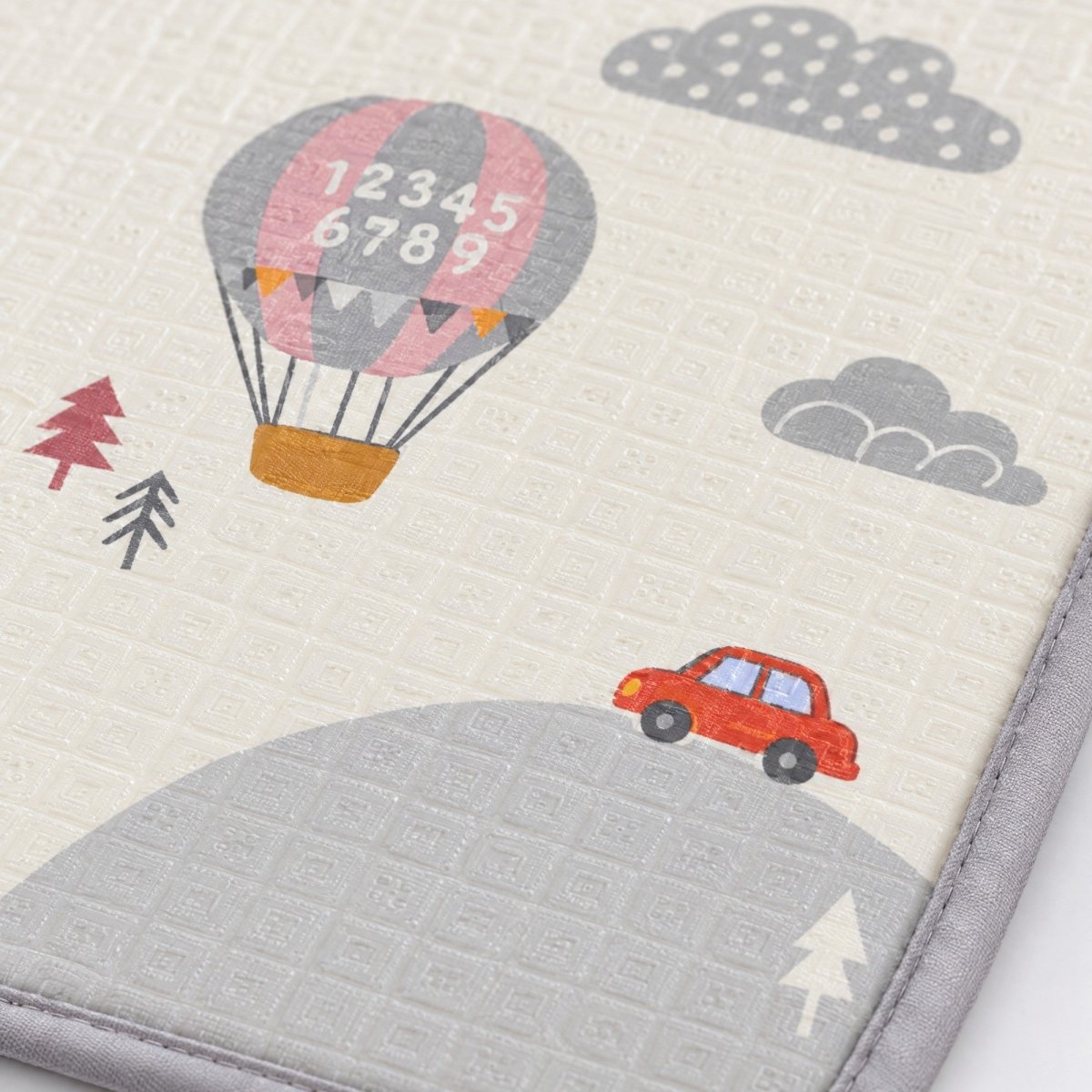 Close-up of the hot-air balloon pattern on the Treelys play mat